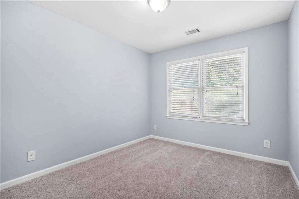 661 North Parkwood Road, Unit C Decatur, GA 30030 - Photo 11 of 14 a view of an empty room with a window