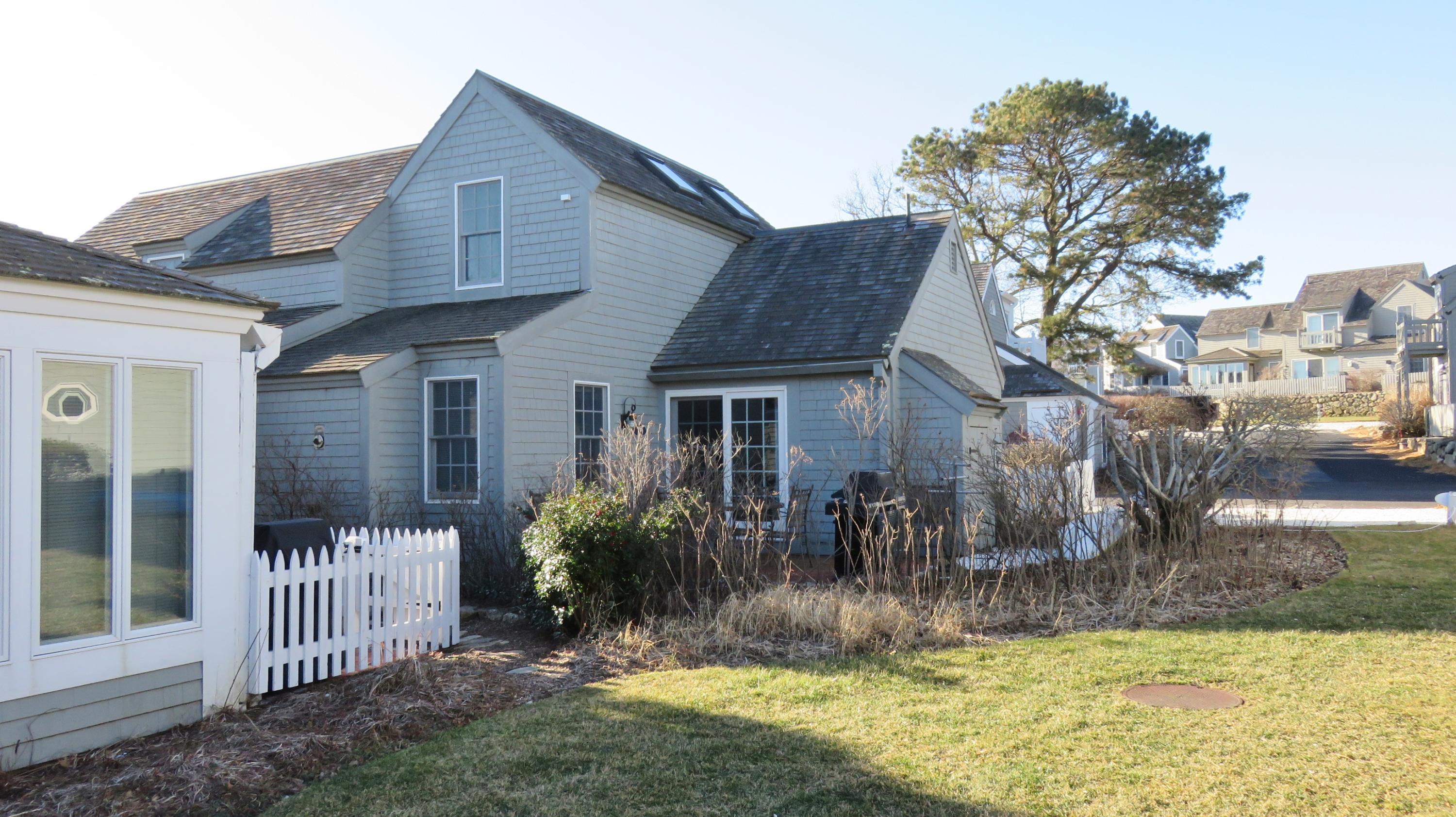 9 Hyannis Point Road, Unit 772 Mashpee, MA 02649 - Photo 2 of 29 a view of a house with a yard