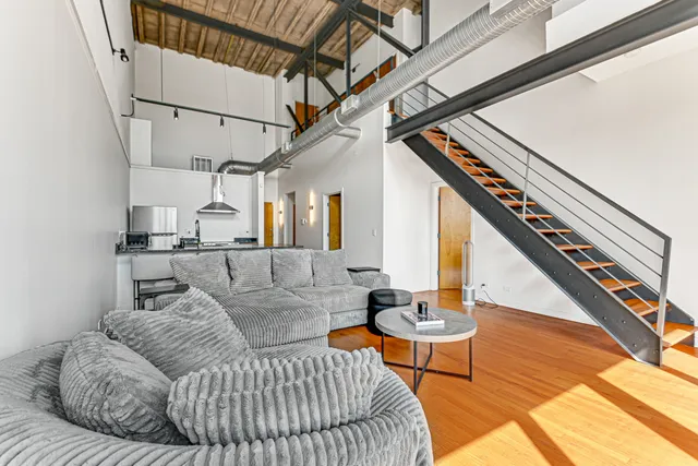 a living room with furniture and a rug