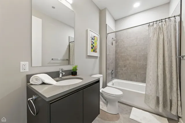 a bathroom with a sink a toilet and a bathtub