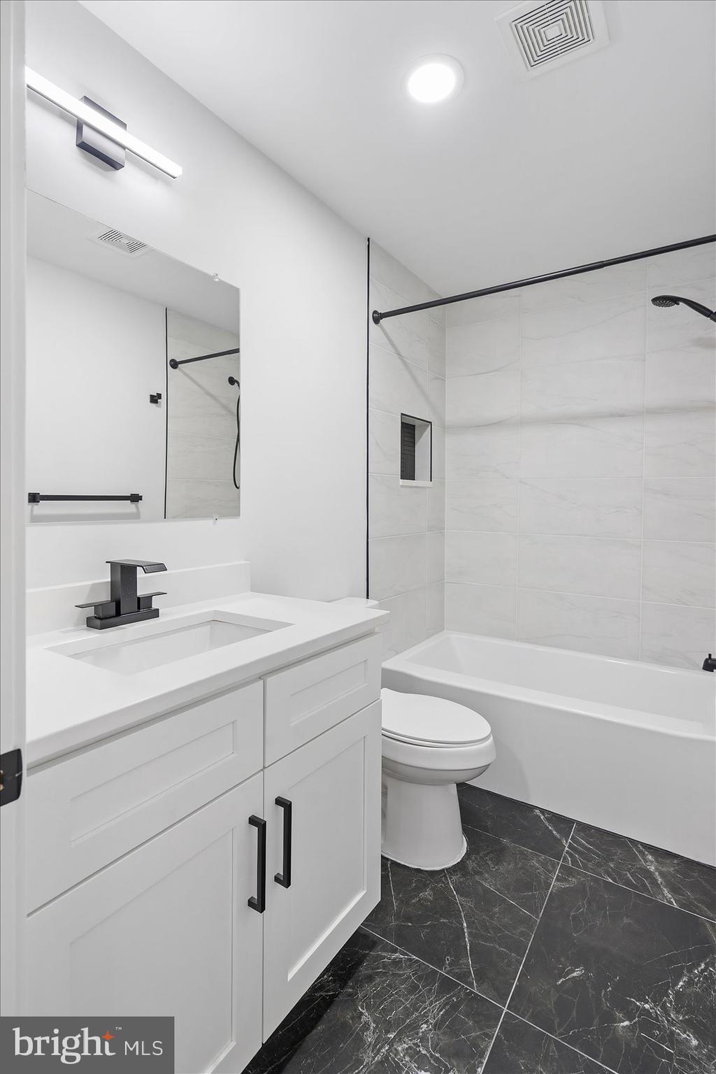11030 Bird River Grove Road White Marsh, MD 21162 - Photo 39 of 53 a bathroom with a sink a toilet and shower