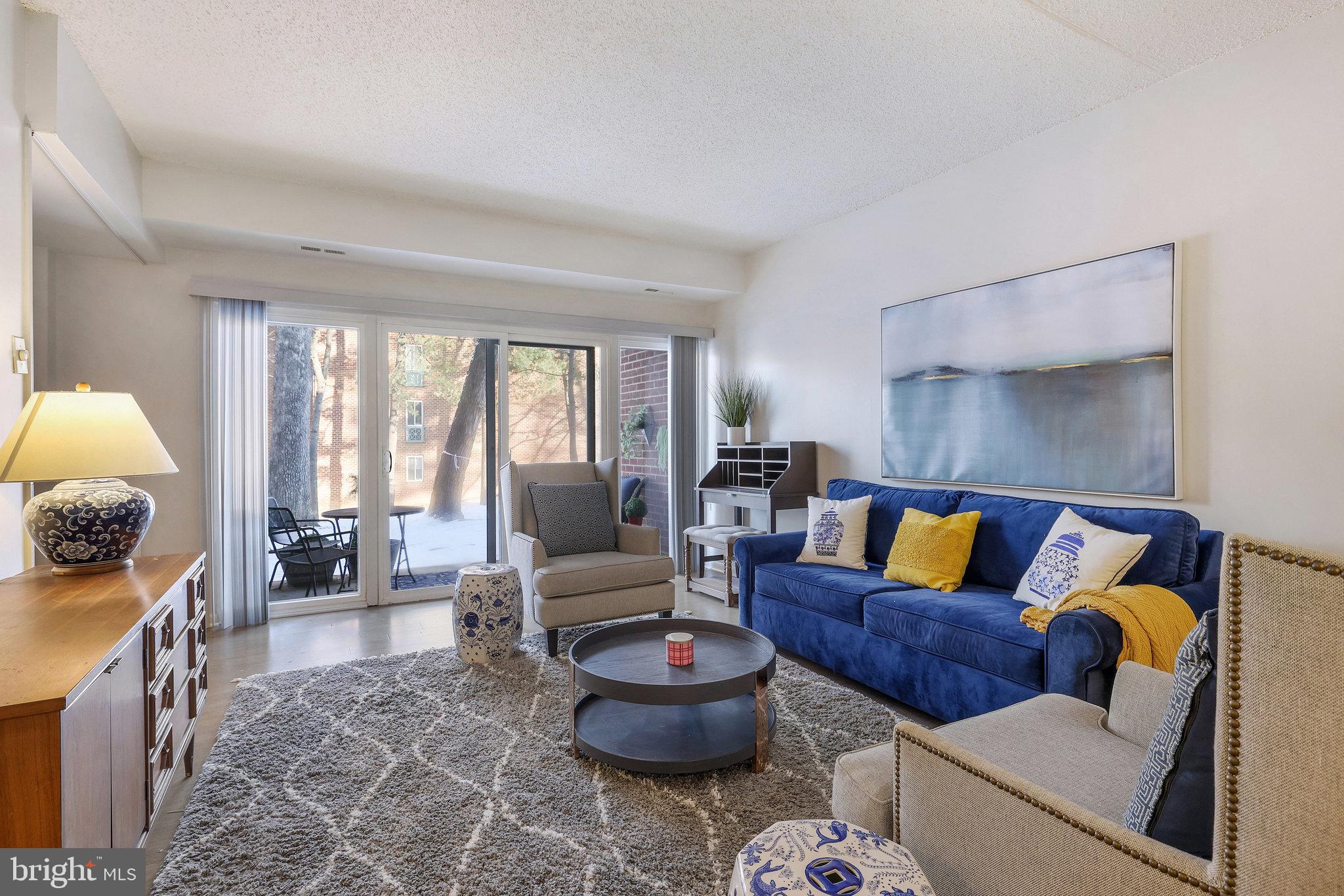 11812 Breton Court, Unit 1A Reston, VA 20191 - Photo 2 of 47 a living room with furniture and a large window