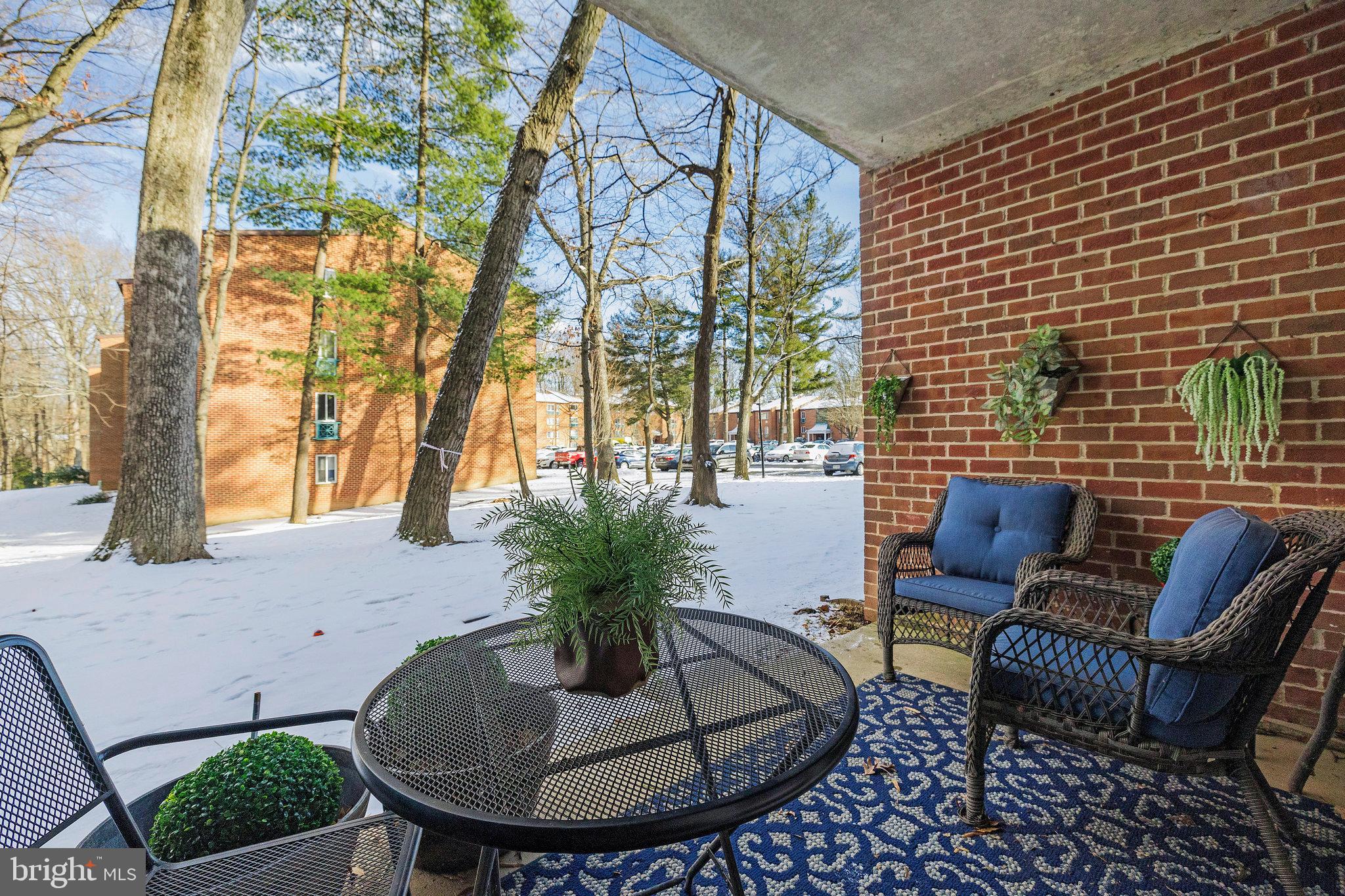 11812 Breton Court, Unit 1A Reston, VA 20191 - Photo 28 of 47 a building outdoor space with patio furniture
