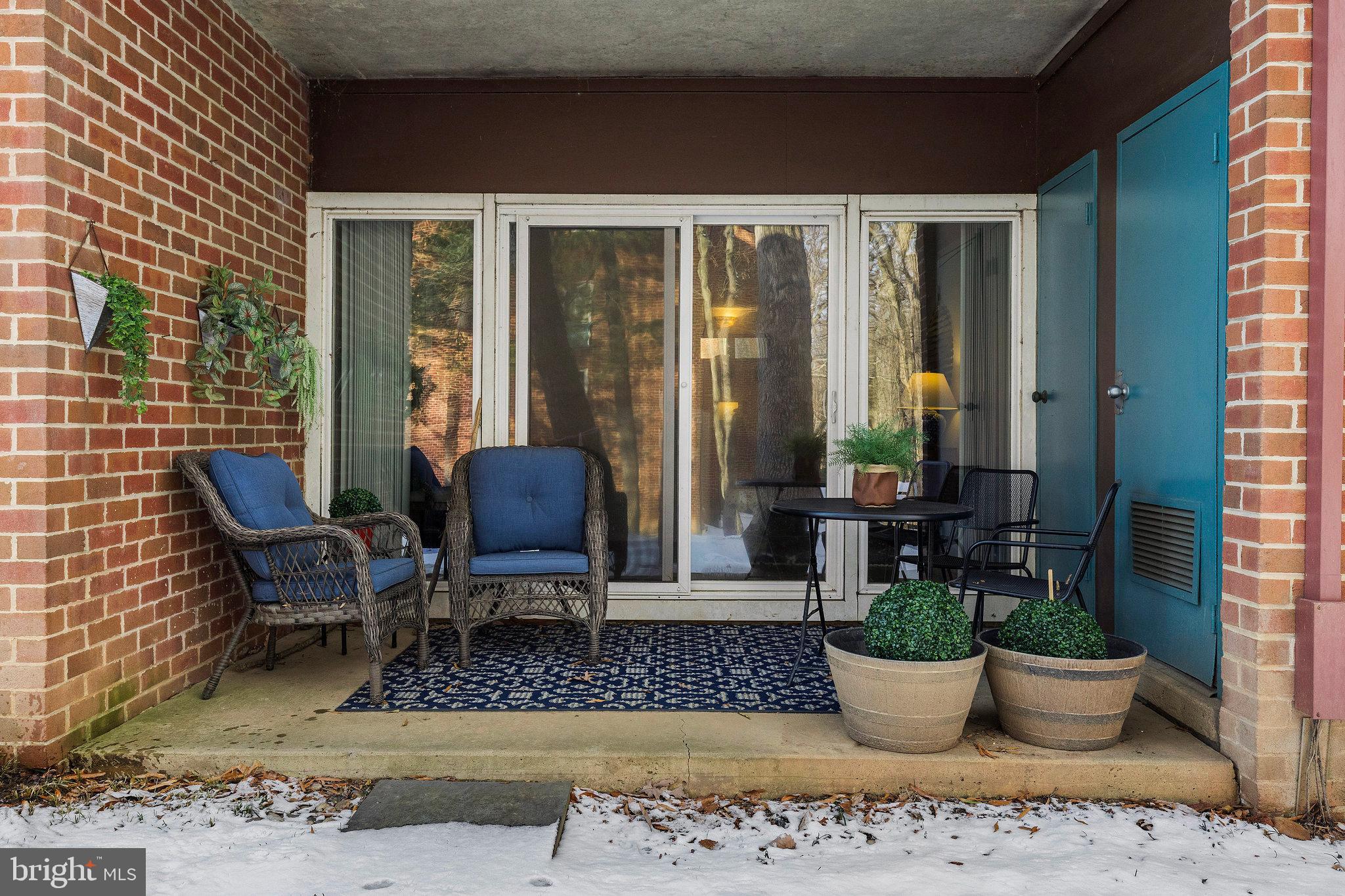 11812 Breton Court, Unit 1A Reston, VA 20191 - Photo 29 of 47 a view of a patio with chairs and potted plants