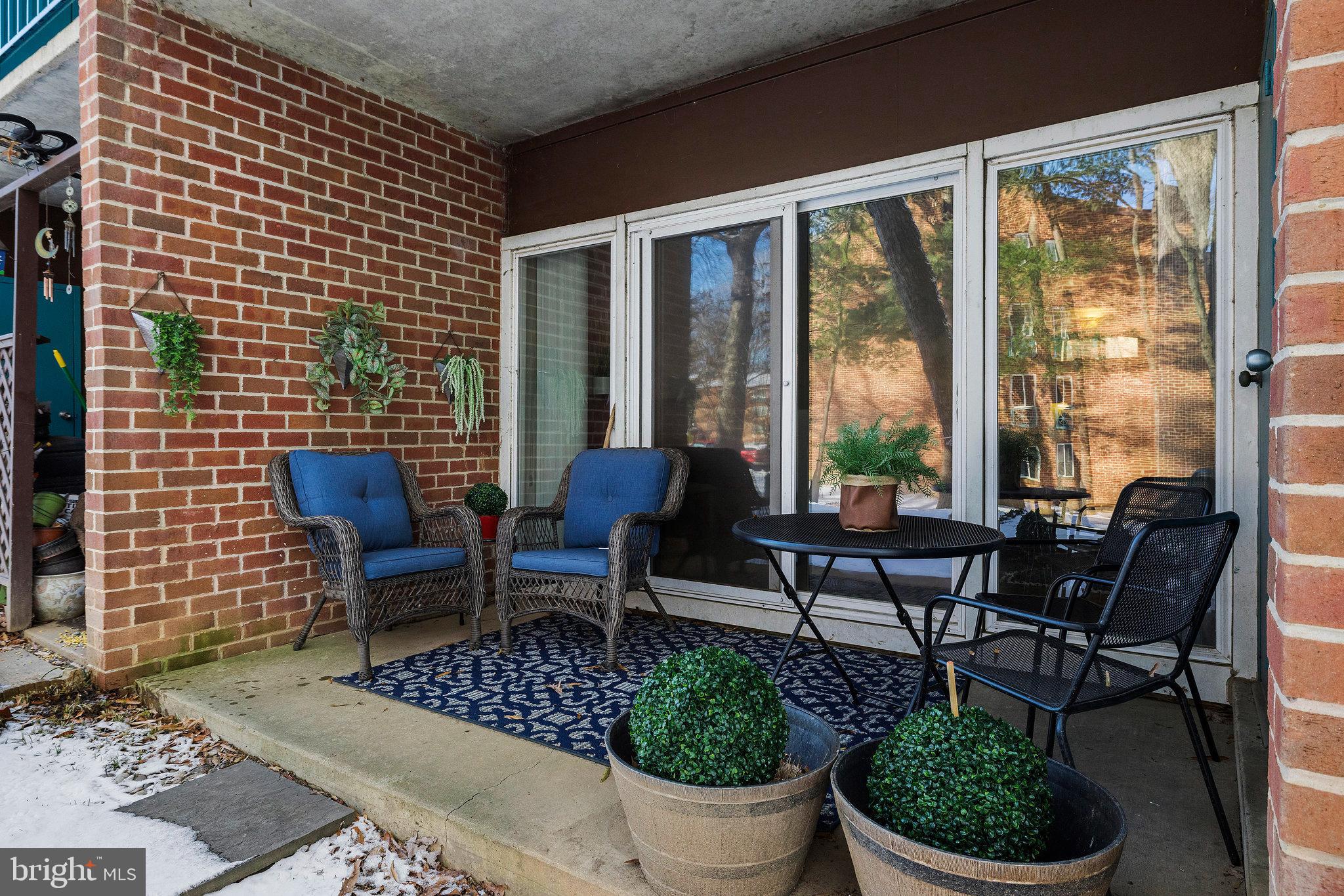 11812 Breton Court, Unit 1A Reston, VA 20191 - Photo 30 of 47 a view of a chairs and table in patio
