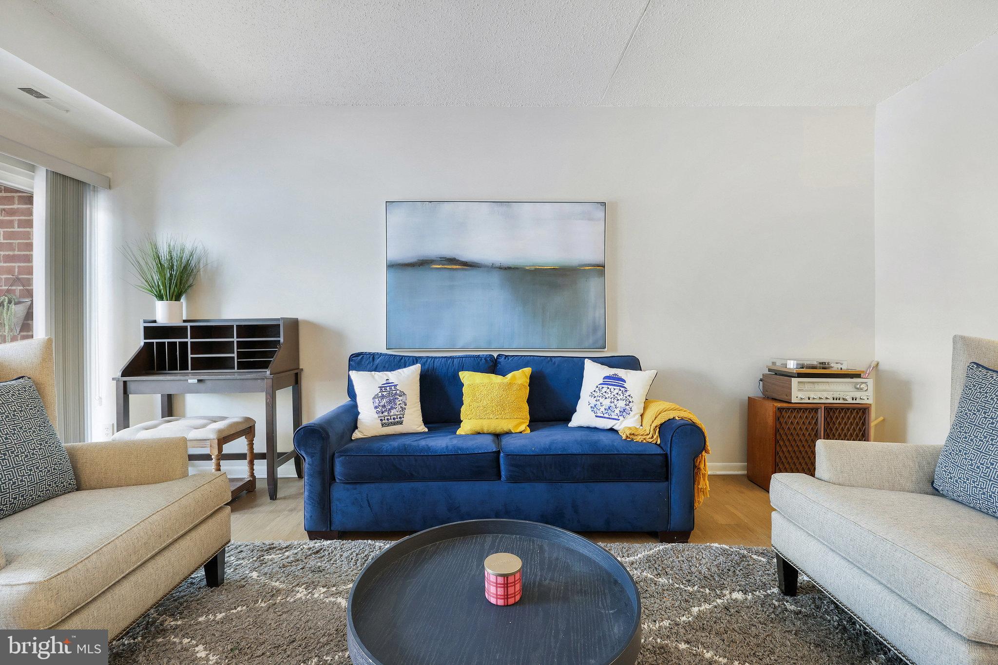 11812 Breton Court, Unit 1A Reston, VA 20191 - Photo 3 of 47 a living room with furniture and a couch