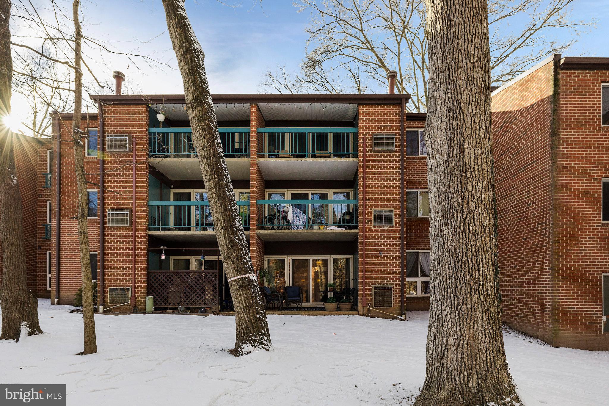 11812 Breton Court, Unit 1A Reston, VA 20191 - Photo 32 of 47 a front view of a building with retail shops