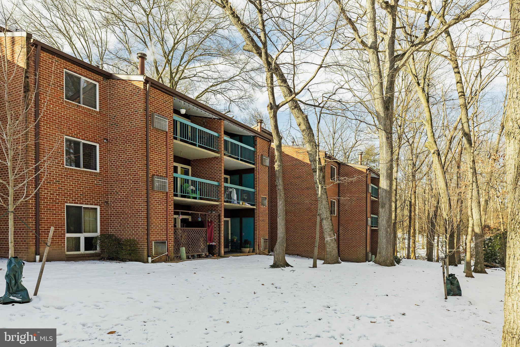 11812 Breton Court, Unit 1A Reston, VA 20191 - Photo 33 of 47 a view of a house with a snow in the yard