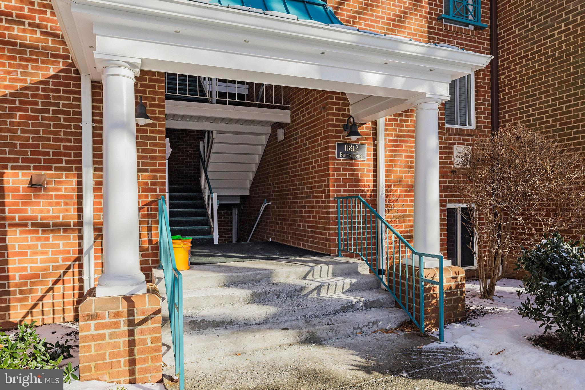 11812 Breton Court, Unit 1A Reston, VA 20191 - Photo 36 of 47 a front view of a house with street