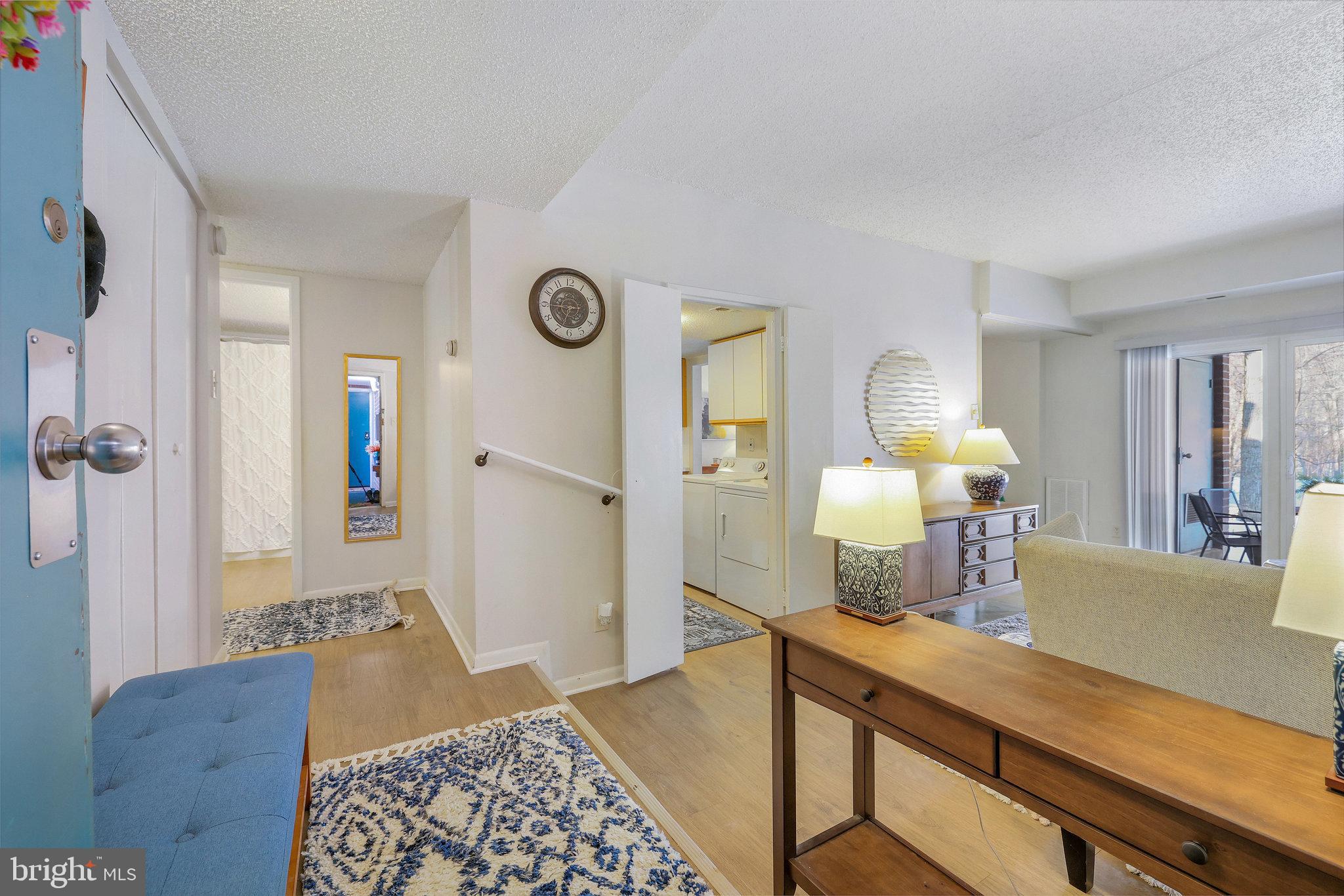 11812 Breton Court, Unit 1A Reston, VA 20191 - Photo 4 of 47 a bedroom with a bed and wooden floor