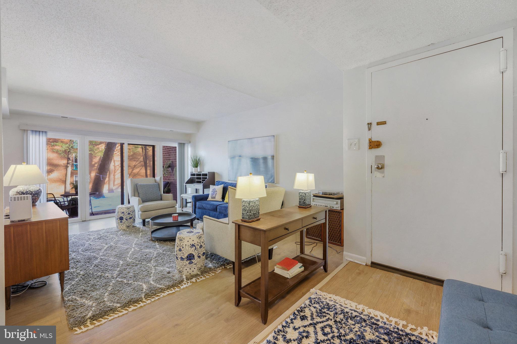 11812 Breton Court, Unit 1A Reston, VA 20191 - Photo 5 of 47 a bed room with furniture and a window