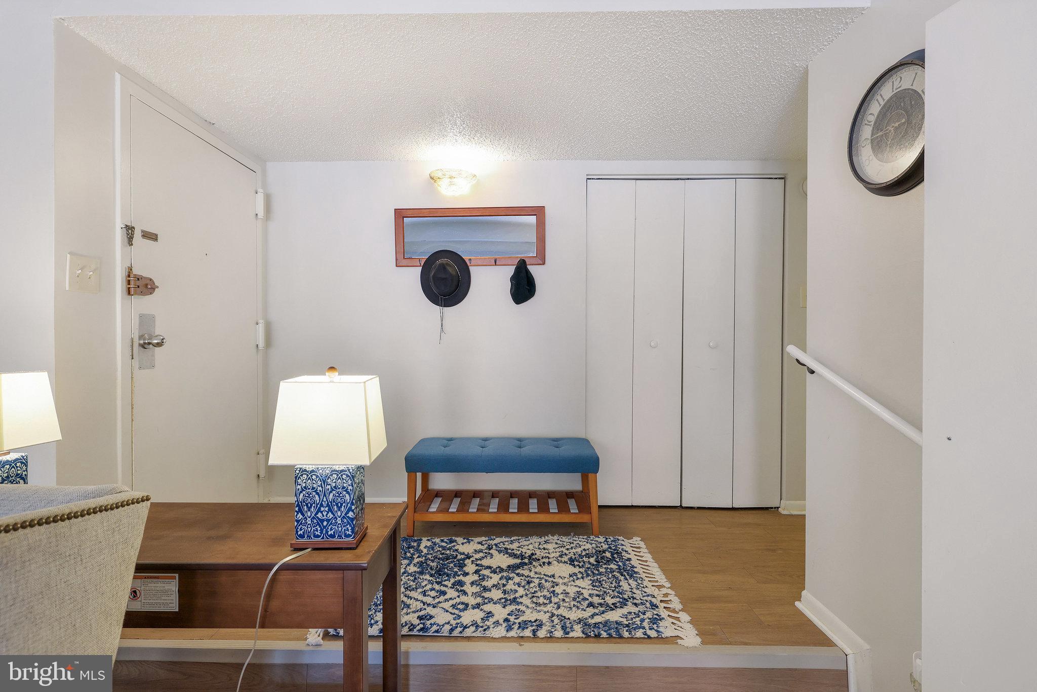 11812 Breton Court, Unit 1A Reston, VA 20191 - Photo 8 of 47 a living room with furniture and a rug