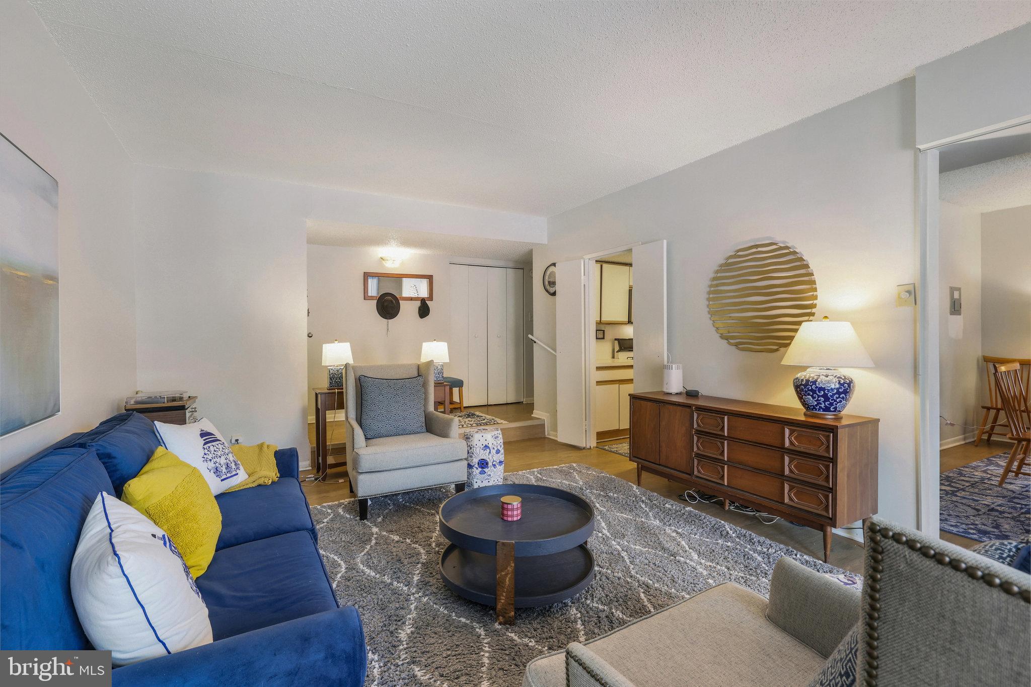 11812 Breton Court, Unit 1A Reston, VA 20191 - Photo 9 of 47 a living room with furniture and a wooden floor