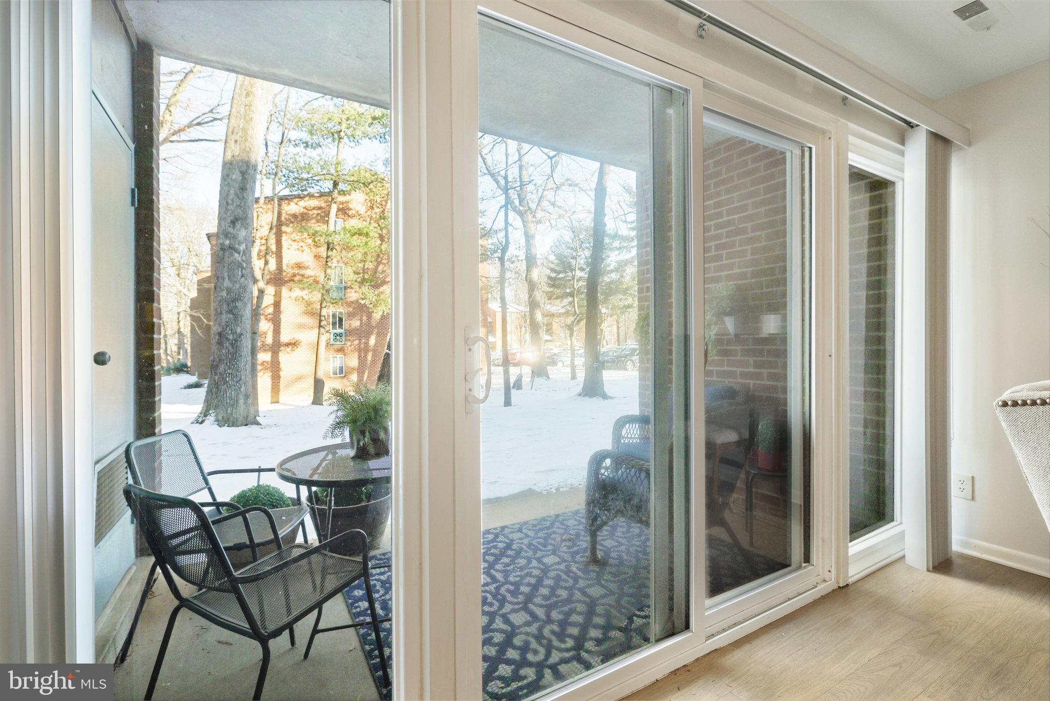 11812 Breton Court, Unit 1A Reston, VA 20191 - Photo 10 of 47 a view of a room with furniture and windows