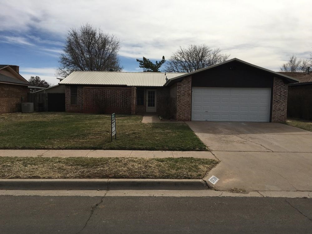 a front view of a house with garage