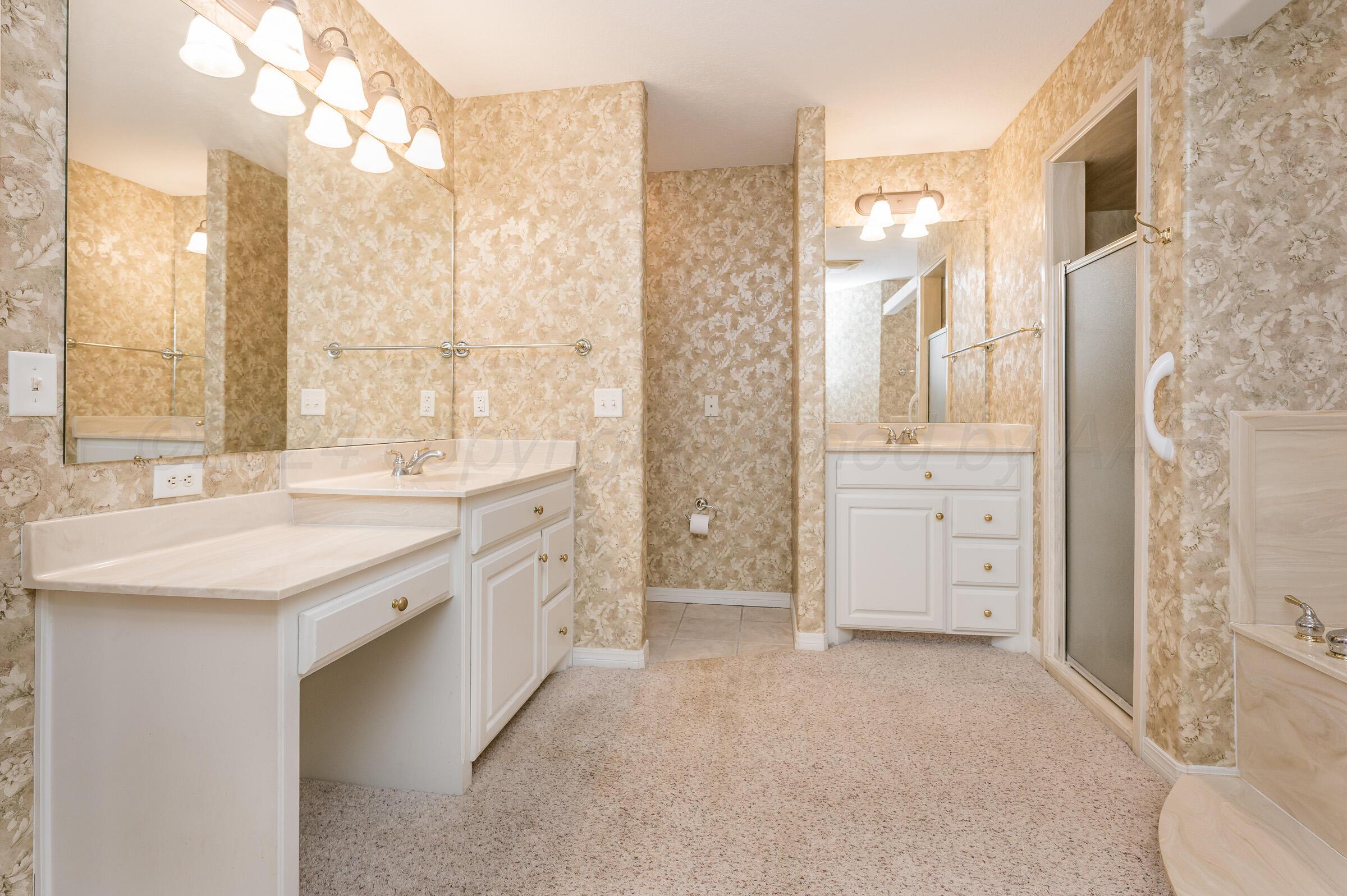 6308 Academy Drive Amarillo, TX 79119 - Photo 13 of 21 a spacious bathroom with a granite countertop sink a mirror and a shower