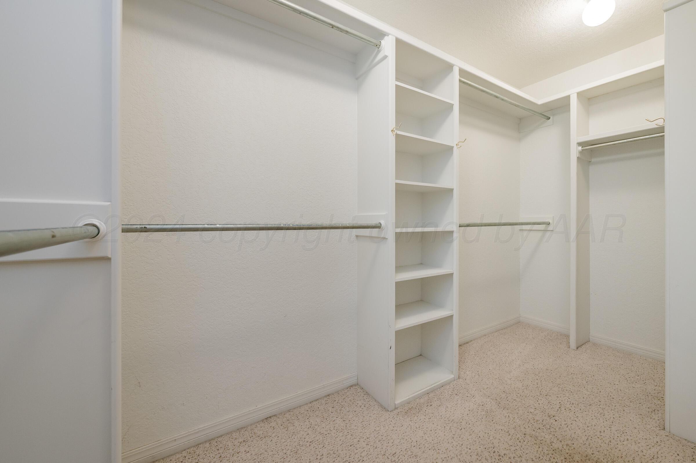 6308 Academy Drive Amarillo, TX 79119 - Photo 15 of 21 a view of an empty walk in closet