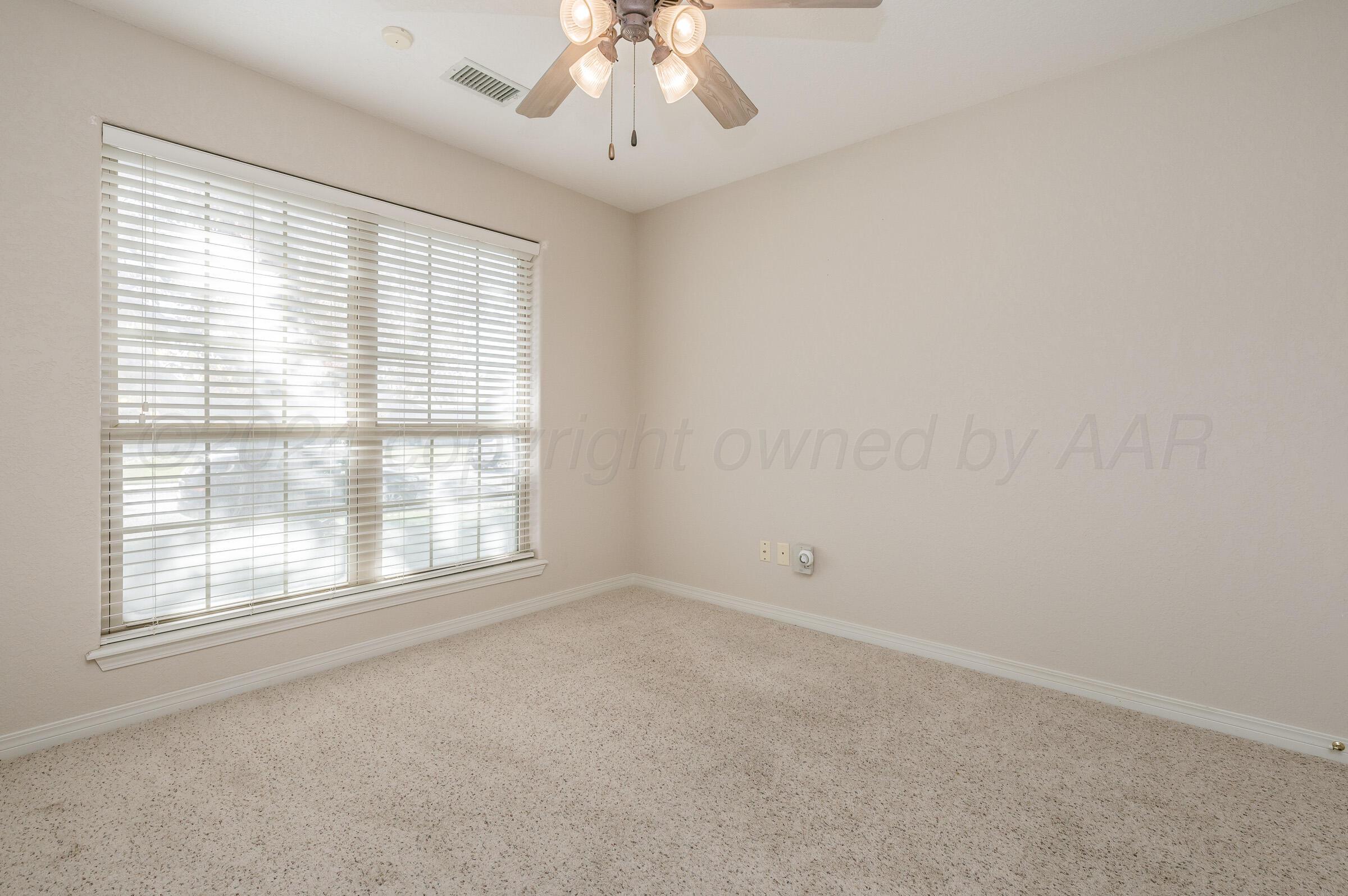 6308 Academy Drive Amarillo, TX 79119 - Photo 16 of 21 an empty room with a window