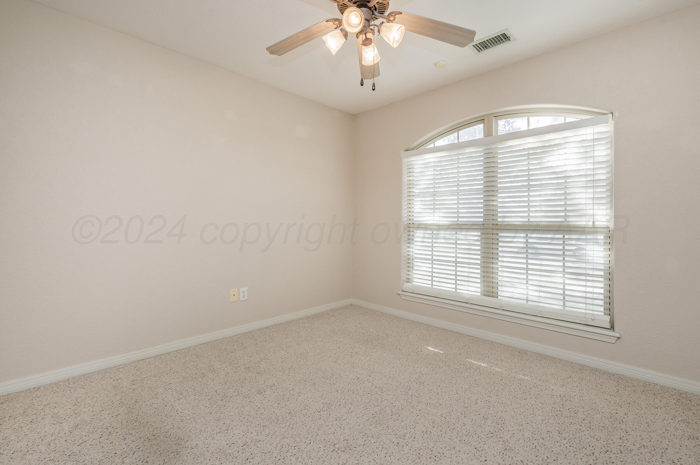6308 Academy Drive Amarillo, TX 79119 - Photo 18 of 21 an empty room with a window
