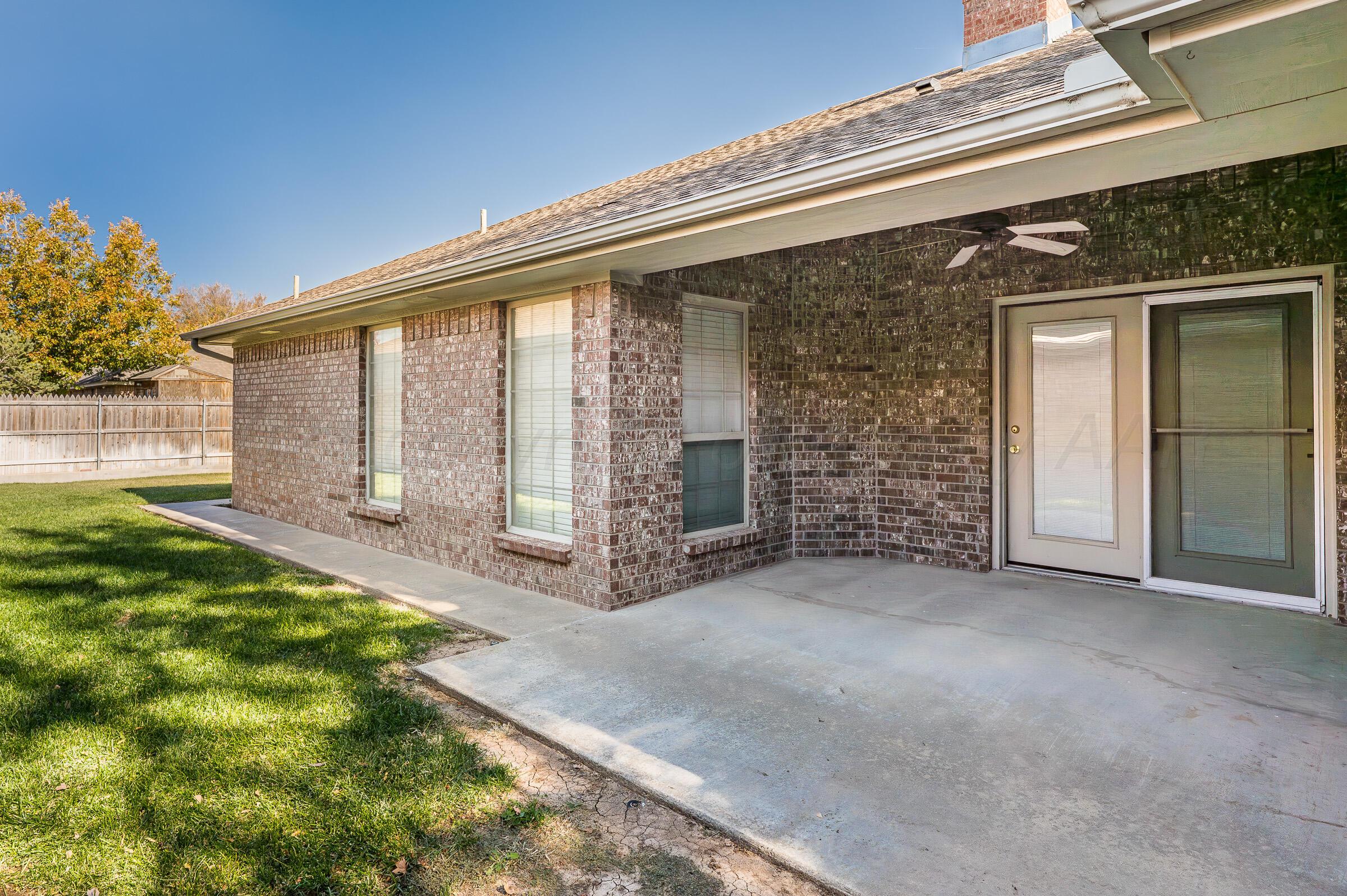 6308 Academy Drive Amarillo, TX 79119 - Photo 19 of 21 front view of a house with a yard