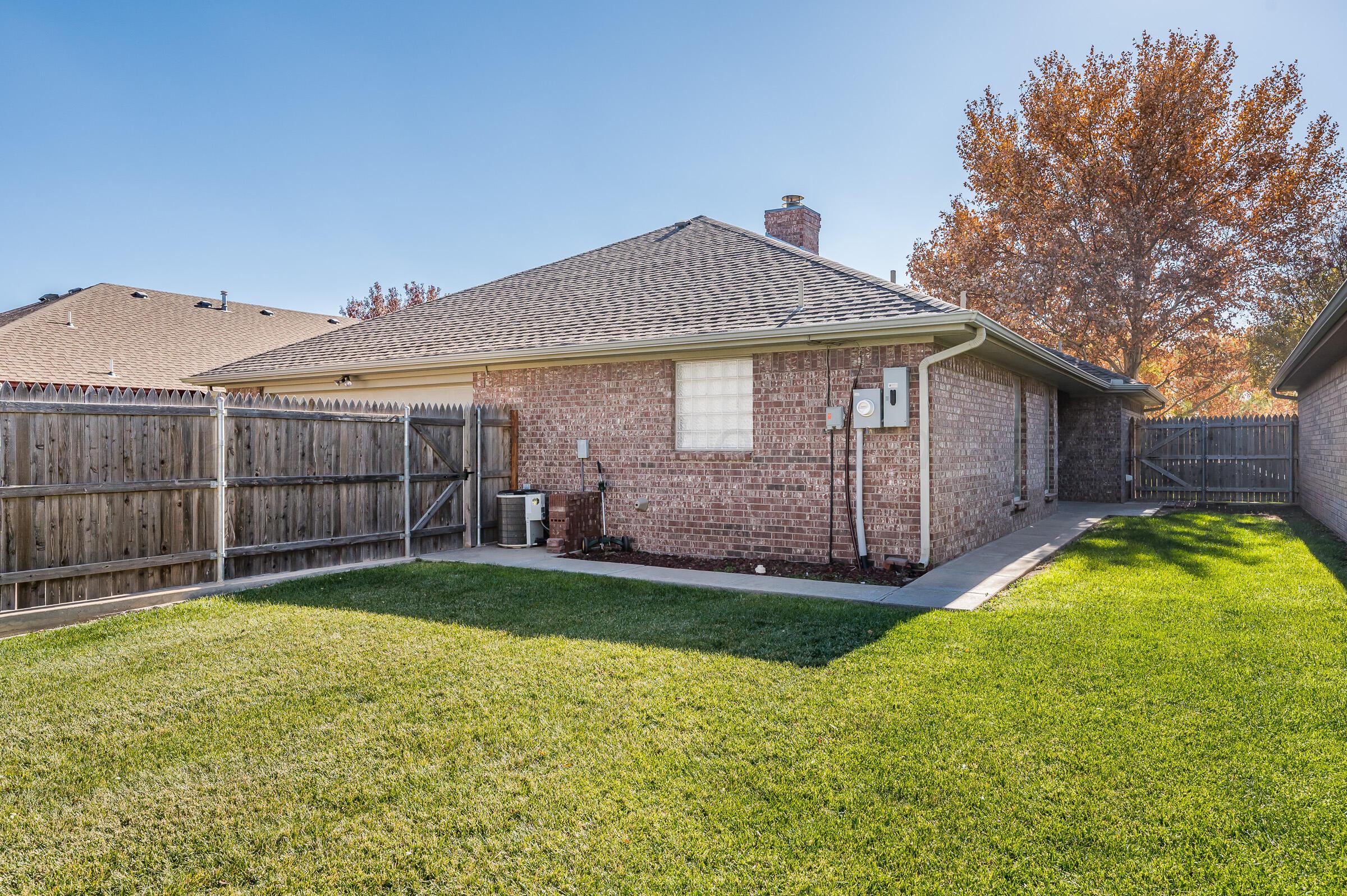 6308 Academy Drive Amarillo, TX 79119 - Photo 20 of 21 a front view of a house with a yard