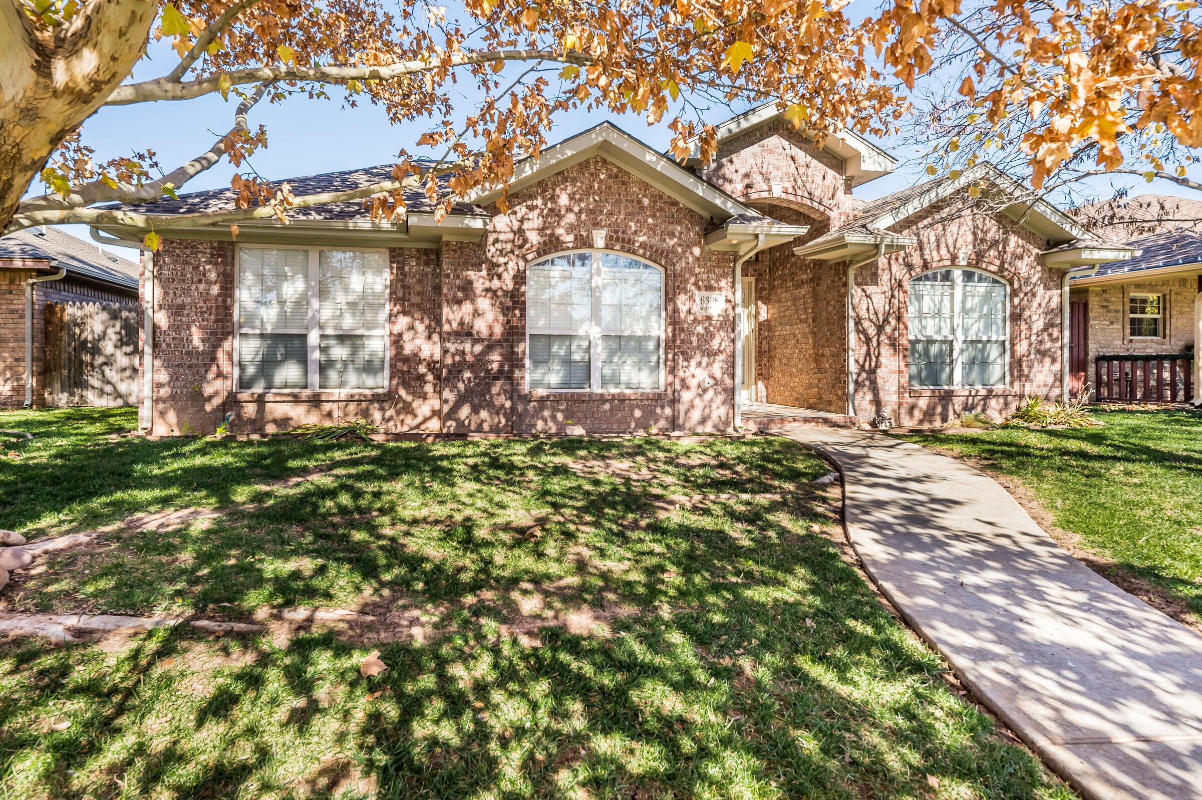 6308 Academy Drive Amarillo, TX 79119 - Photo 2 of 21 a front view of a house with a yard