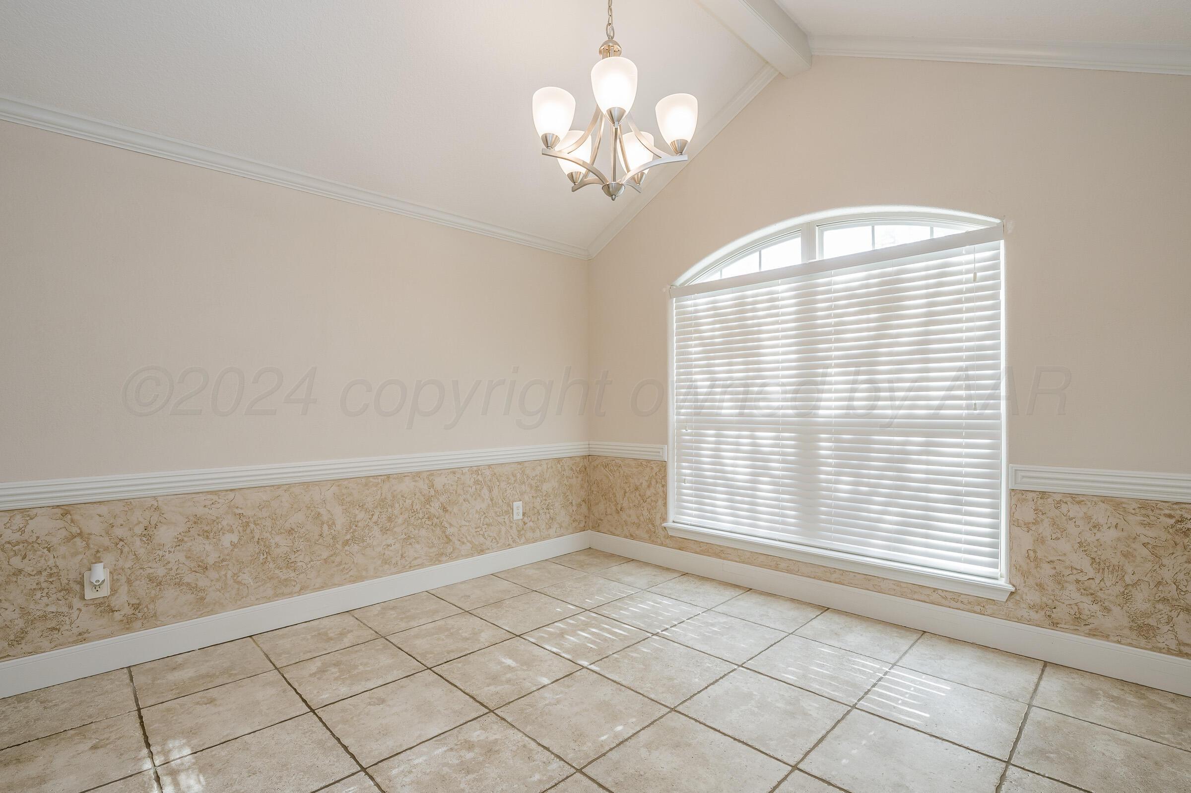 6308 Academy Drive Amarillo, TX 79119 - Photo 4 of 21 a view of an empty room with a window