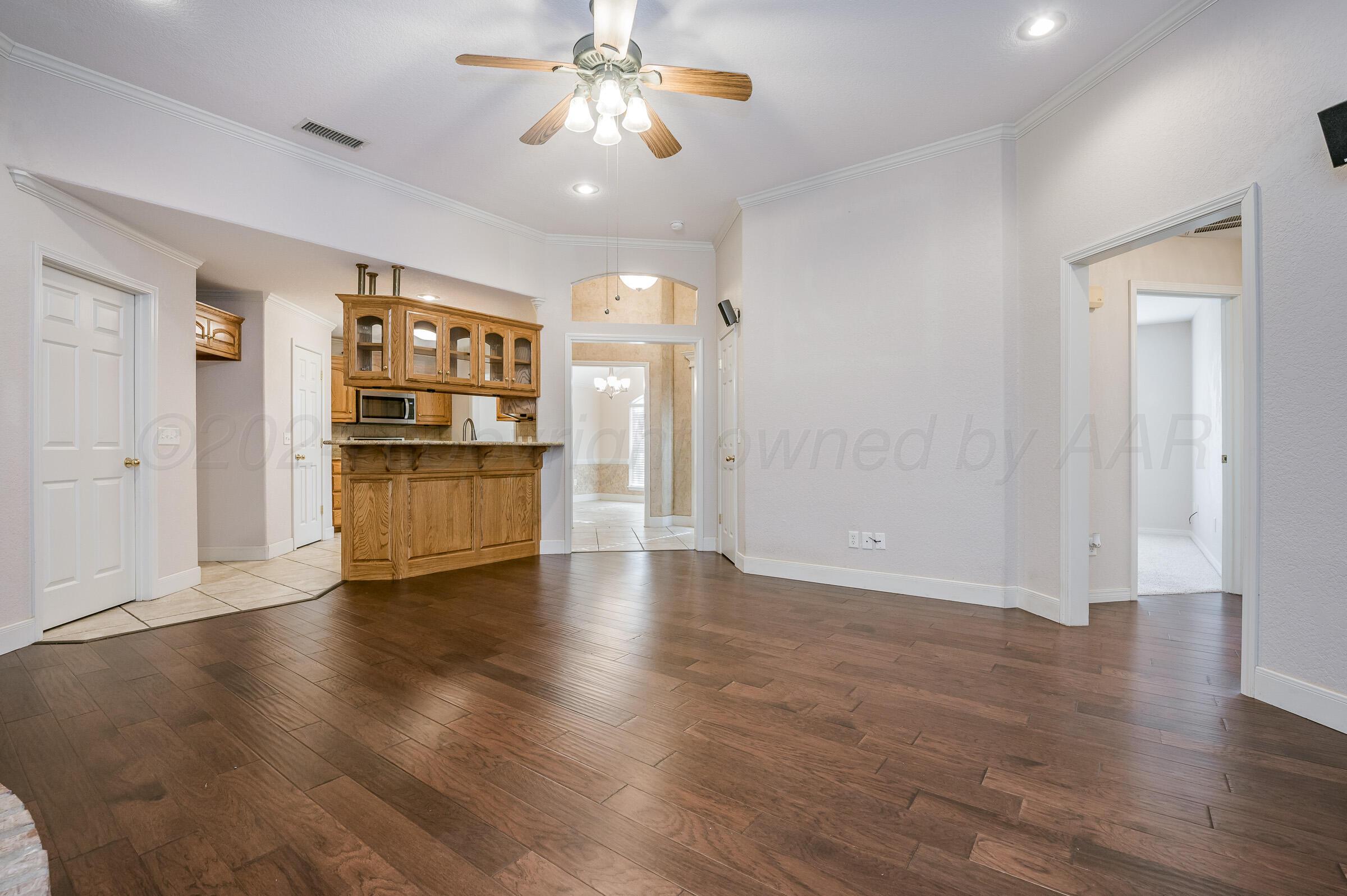 6308 Academy Drive Amarillo, TX 79119 - Photo 7 of 21 a view of empty room with wooden floor