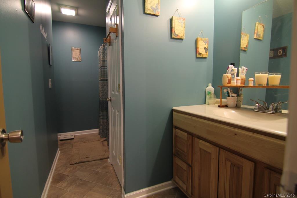 3807 White Store Road, Unit TRACT 1 W Wingate, NC 28174 - Photo 17 of 20 a bathroom with a sink and a mirror