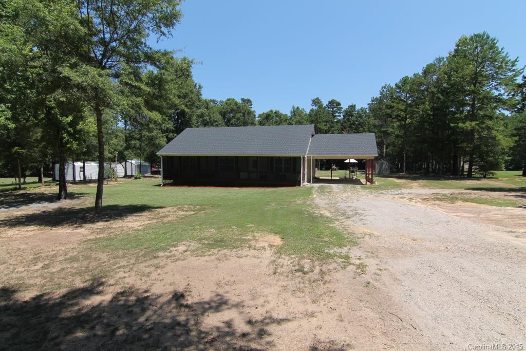 3807 White Store Road, Unit TRACT 1 W Wingate, NC 28174 - Photo 4 of 20 a view of a backyard with a garden and trees