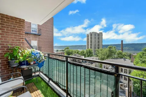 a bedroom with two beds and a flat screen tv