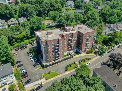 a utility room with multiple dryer and washer