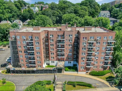 a view of an empty room with large windows
