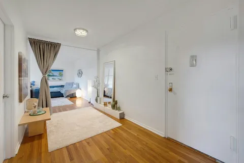 a bed room with a bed and a window