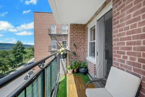 a view of balcony with furniture