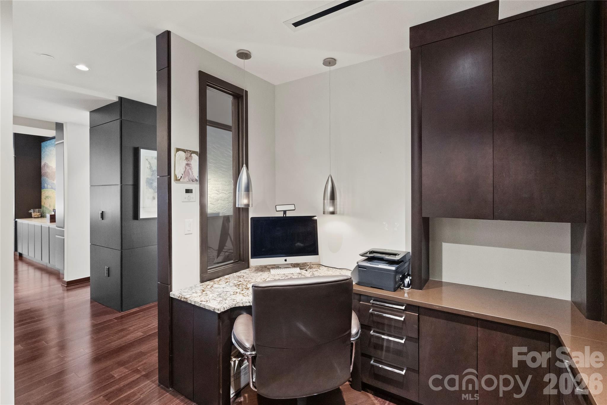 139 South Tryon Street, Unit 6 Charlotte, NC 28202 - Photo 23 of 47 a view of workspace with wooden floor entryway