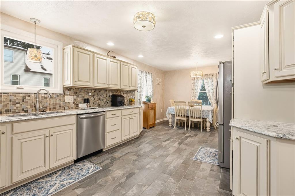 276 Glessner Road Johnstown, PA 15905 - Photo 11 of 36 a kitchen with table chairs and cabinets