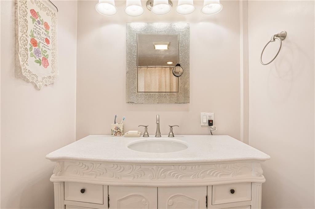 276 Glessner Road Johnstown, PA 15905 - Photo 21 of 36 a bathroom with a granite countertop sink and a mirror