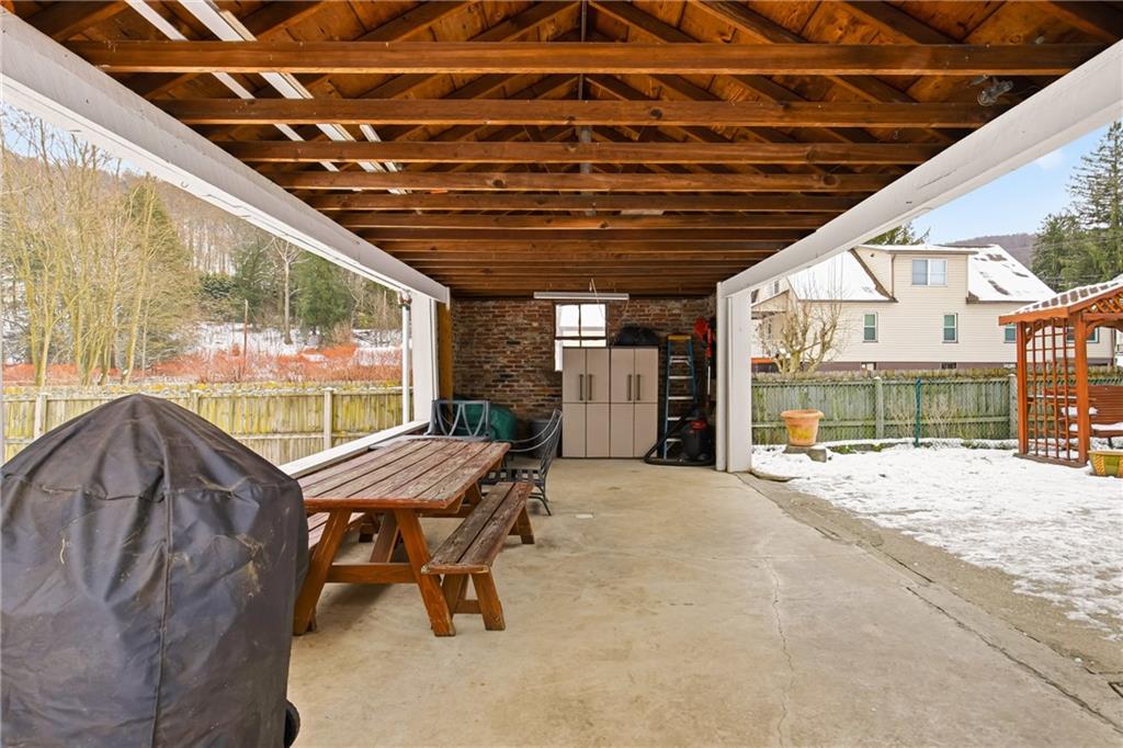 276 Glessner Road Johnstown, PA 15905 - Photo 33 of 36 a view of a porch with furniture and a yard