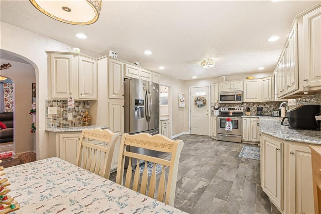 276 Glessner Road Johnstown, PA 15905 - Photo 9 of 36 a kitchen with stainless steel appliances kitchen island granite countertop a refrigerator sink and cabinets