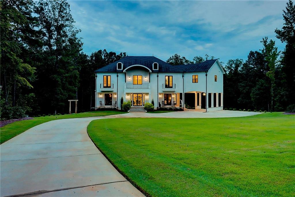 7505 Hollis Road Douglasville, GA 30135 - Photo 1 of 1 a view of a house with a big yard plants and large trees
