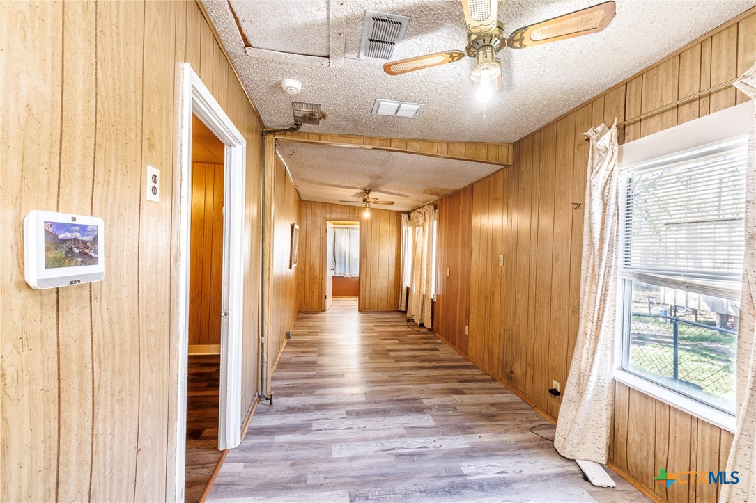 921 Robertson Gonzales, TX 78629 - Photo 19 of 31 a view of a hallway with wooden floor and staircase