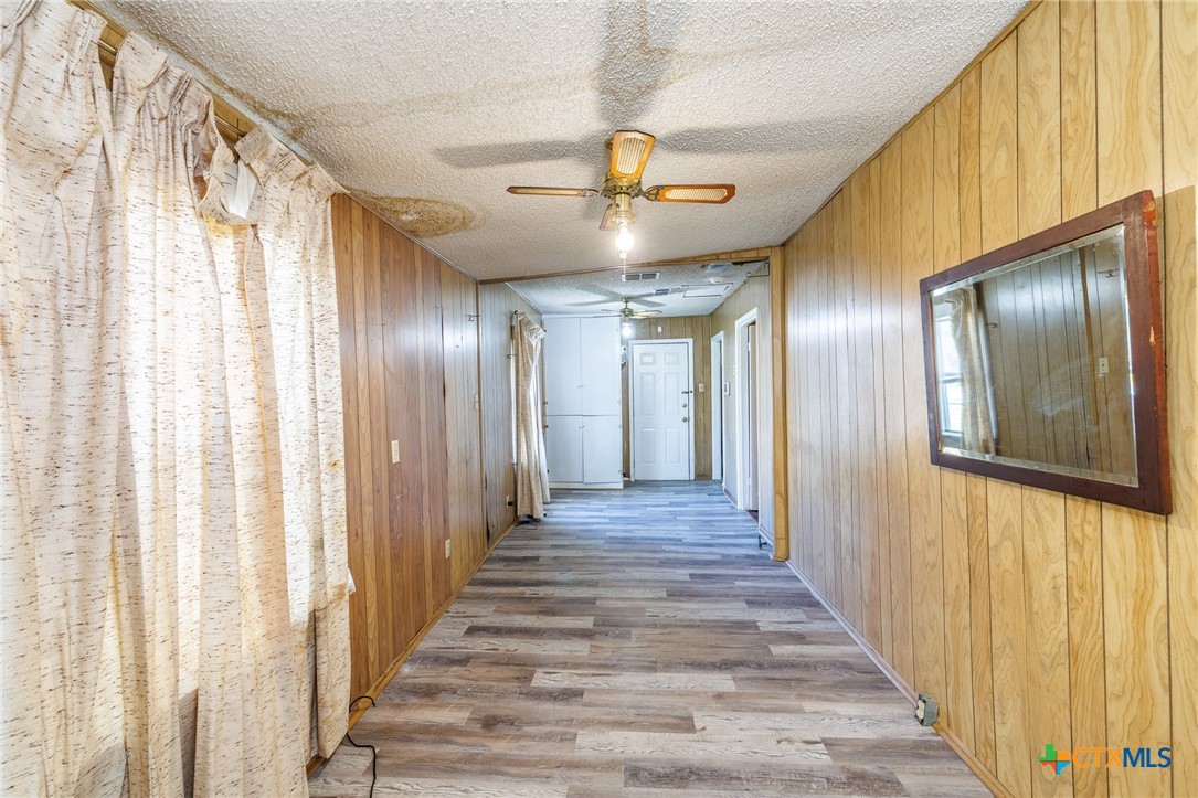 921 Robertson Gonzales, TX 78629 - Photo 20 of 31 a view of a hallway with wooden floor and staircase