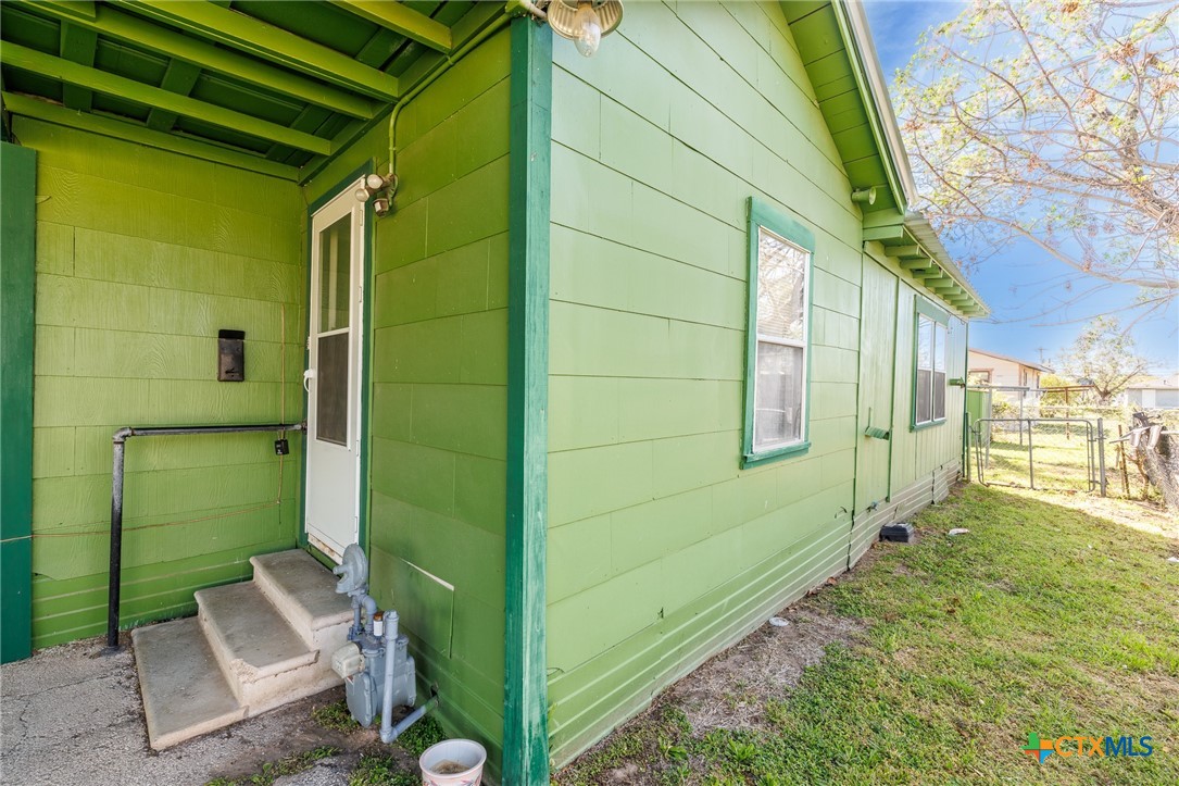 921 Robertson Gonzales, TX 78629 - Photo 25 of 31 Side of home with entrance to Storage room