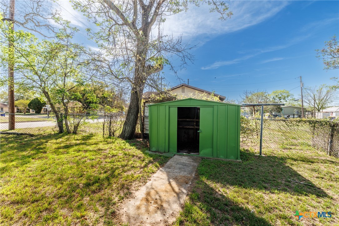 921 Robertson Gonzales, TX 78629 - Photo 30 of 31 a view of a yard with large tree