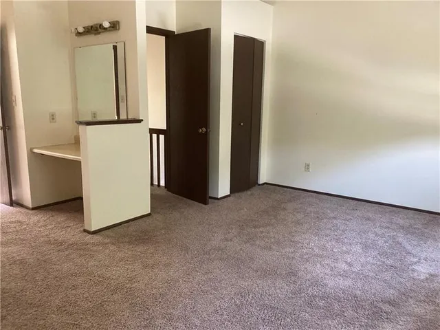 a view of hallway with closet