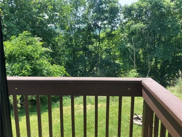 a balcony with an outdoor space