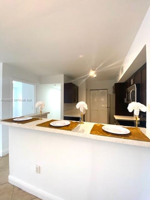 2061 Renaissance Boulevard, Unit 204 Miramar, FL 33025 - Photo 27 of 30 a swimming pool with a stove and chairs