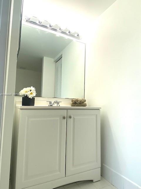 2061 Renaissance Boulevard, Unit 204 Miramar, FL 33025 - Photo 29 of 30 a bathroom with a sink and a mirror