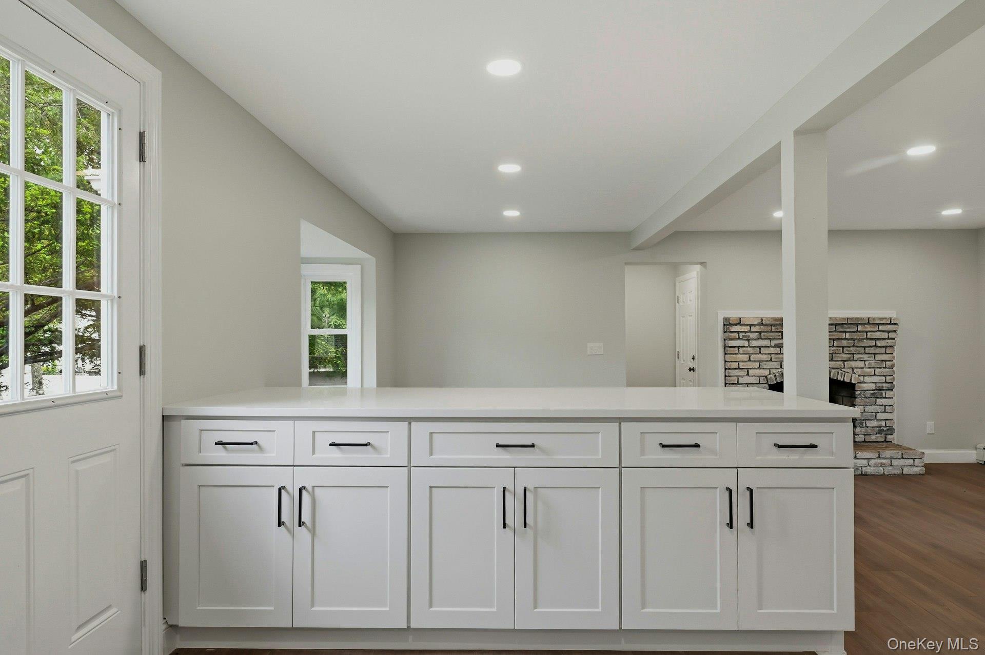 101 Rustic Road Centereach, NY 11720 - Photo 20 of 42 a kitchen with white cabinets and sink